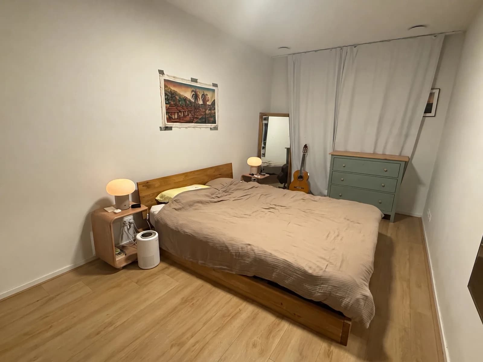 The same bedroom with a grey-green IKEA HEMNES chest of drawers where the desk was