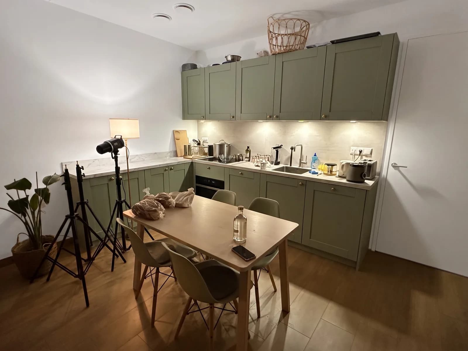 The same kitchen with sage-green shaker cabinets, a marble worktop and an extra run along the left wall, as on a Pinterest pin